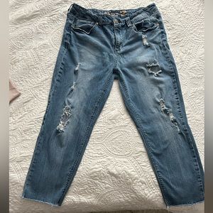 Women’s Seven Distressed jeans.